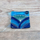 Inspired by the iconic Lotus flower this handmade large dish is made using rich expressive blue and turquoise coloured glass and finished with delicate hand-painted details.
