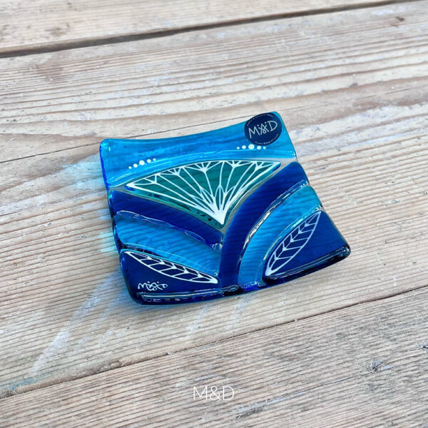 Inspired by the iconic Lotus flower this handmade large dish is made using rich expressive blue and turquoise coloured glass and finished with delicate hand-painted details.
