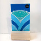 Inspired by the iconic Lotus flower this standing sun catcher is made using rich expressive blue and turquois coloured glass and finished with delicate hand-painted details.