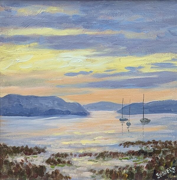 A peaceful coastal painting at sunrise or sunset, with warm yellow and orange light reflecting across calm water. Two anchored sailboats sit near the horizon, backed by layered blue hills. The foreground shows textured strokes of dark seaweed and shoreline vegetation.