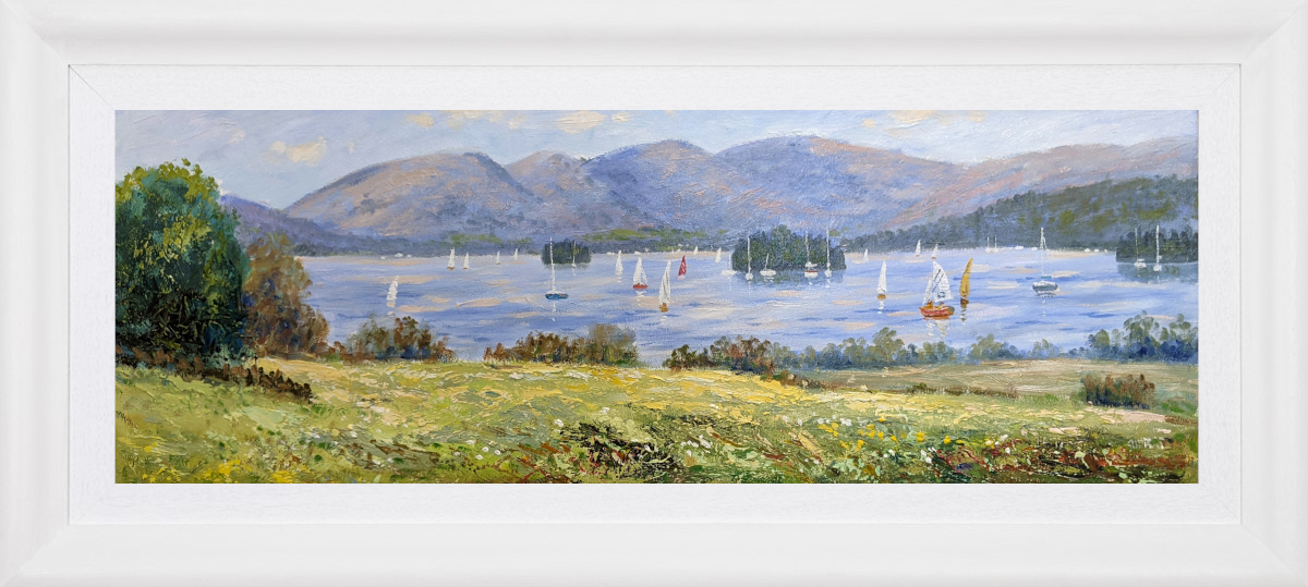 Lake District art original oil painting by Jeff Sudders featuring a meadow overlooking multiple sailboats on the water of Windermere. Fells in the distance with blue skies. Displayed in a white cushion frame.