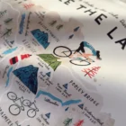Cycle The Lakes Tea Towel by Oldfield Design Co based on the edge of The Lake District Nation Park creators of crafted prints and keepsakes Celebrating a life lived outdoors and up north