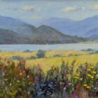 Lake District art original oil painting by Jeff Sudders. A summer scene of Ullswater bright foliage in the foreground yellow fields and vast view off the lake and fells in the distance.