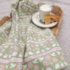 Organic cotton tea towel by Miller Honeyman in Bunny and bird design in pink and green.