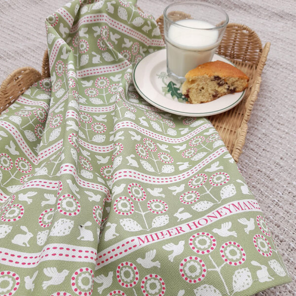 Organic cotton tea towel by Miller Honeyman in Bunny and bird design in pink and green.