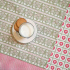 Organic cotton tea towel by Miller Honeyman in bunny and bird design in pink and green.