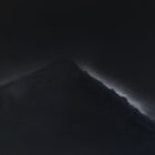 lake district art afterlight great gable from wasdale by daniel cooper of white light picking out the mountain outline with dramatic black sky