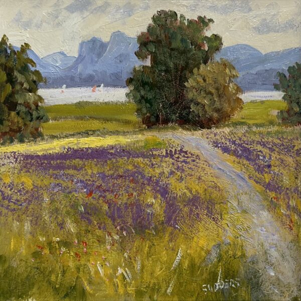 Landscape painting of a field with purple flowers, winding path, trees, lake and distant blue mountains.
